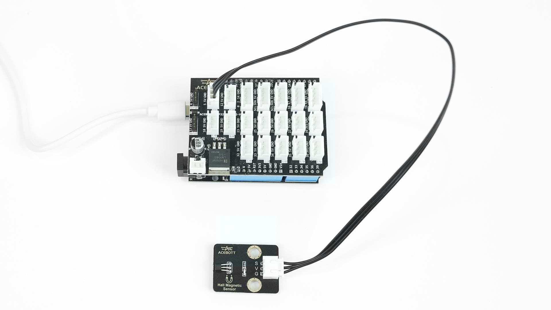 ACEBOTT QB116 Hall Sensor module connected to an ESP32 controller board with cable for magnetic detection testing