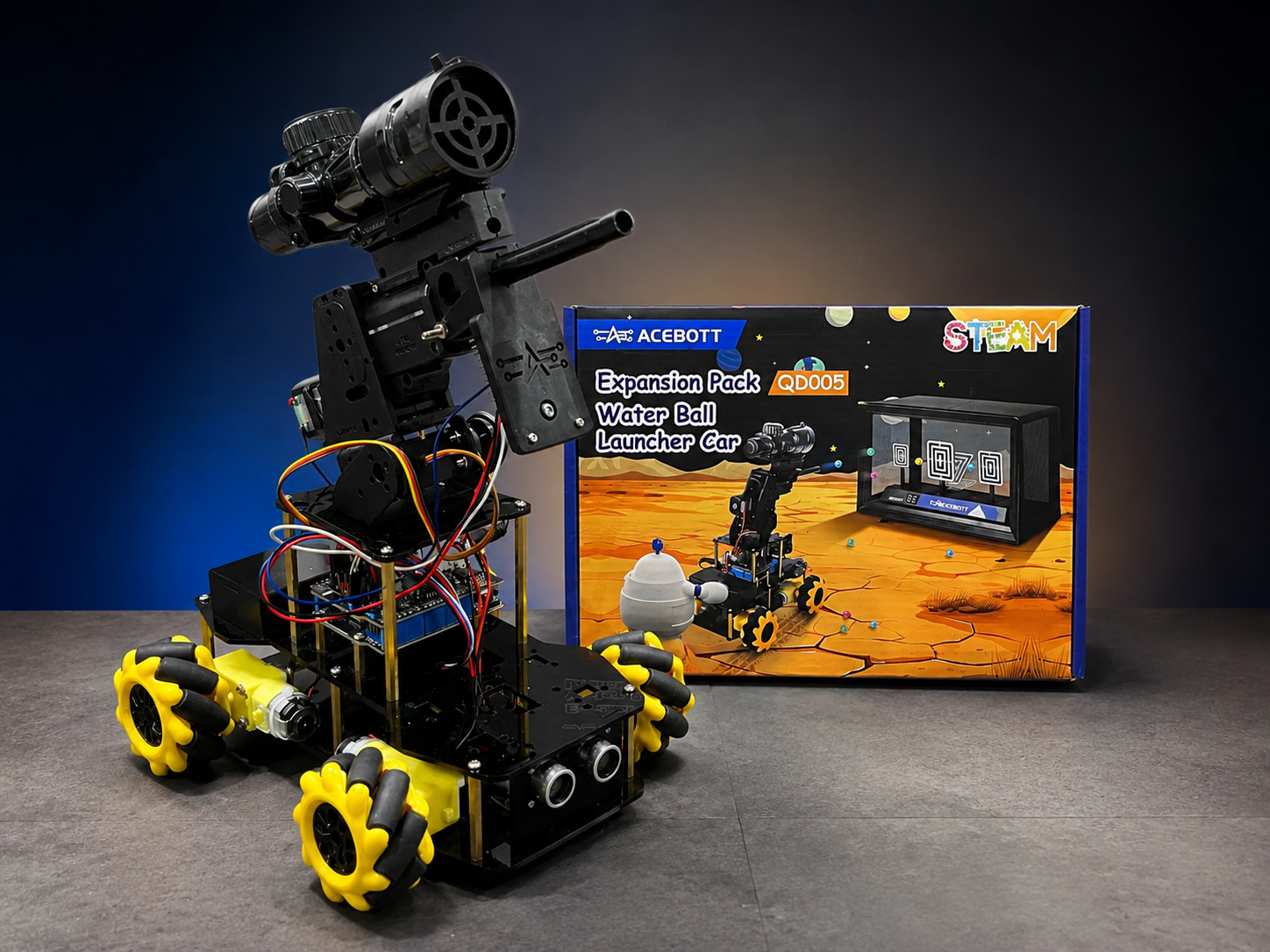 ACEBOTT QD001 FPV battle robot with QD005 water launcher displayed beside the expansion pack box