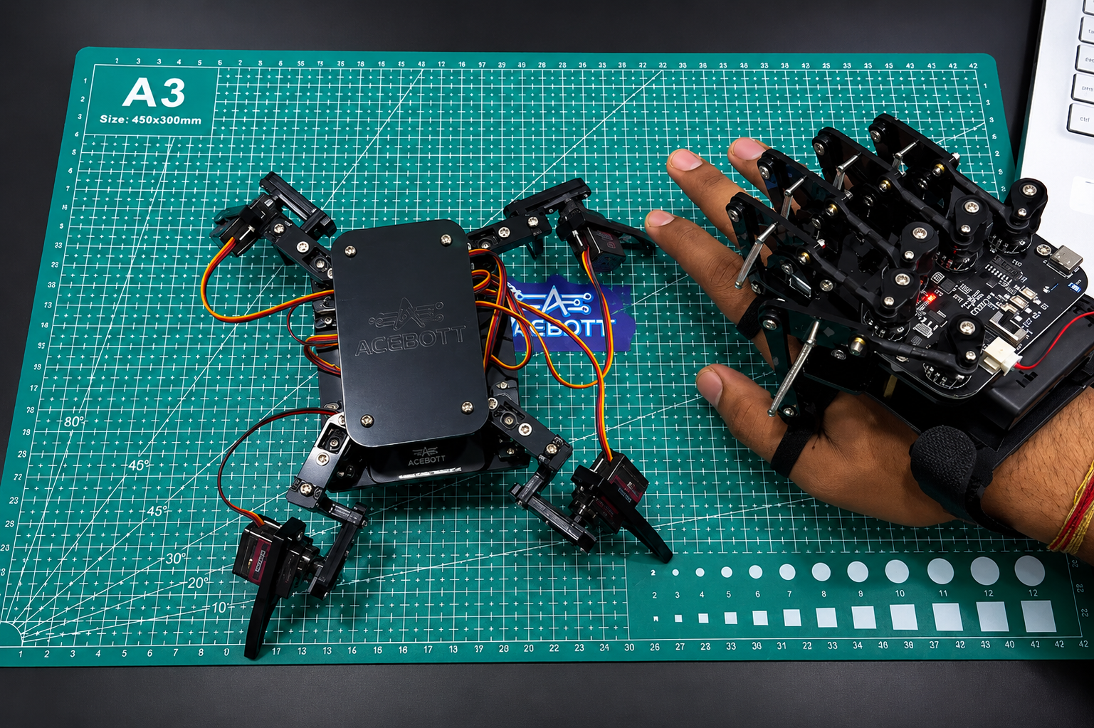 ACEBOTT QD023 Motion Sensing Glove controlling an ACEBOTT spider robot