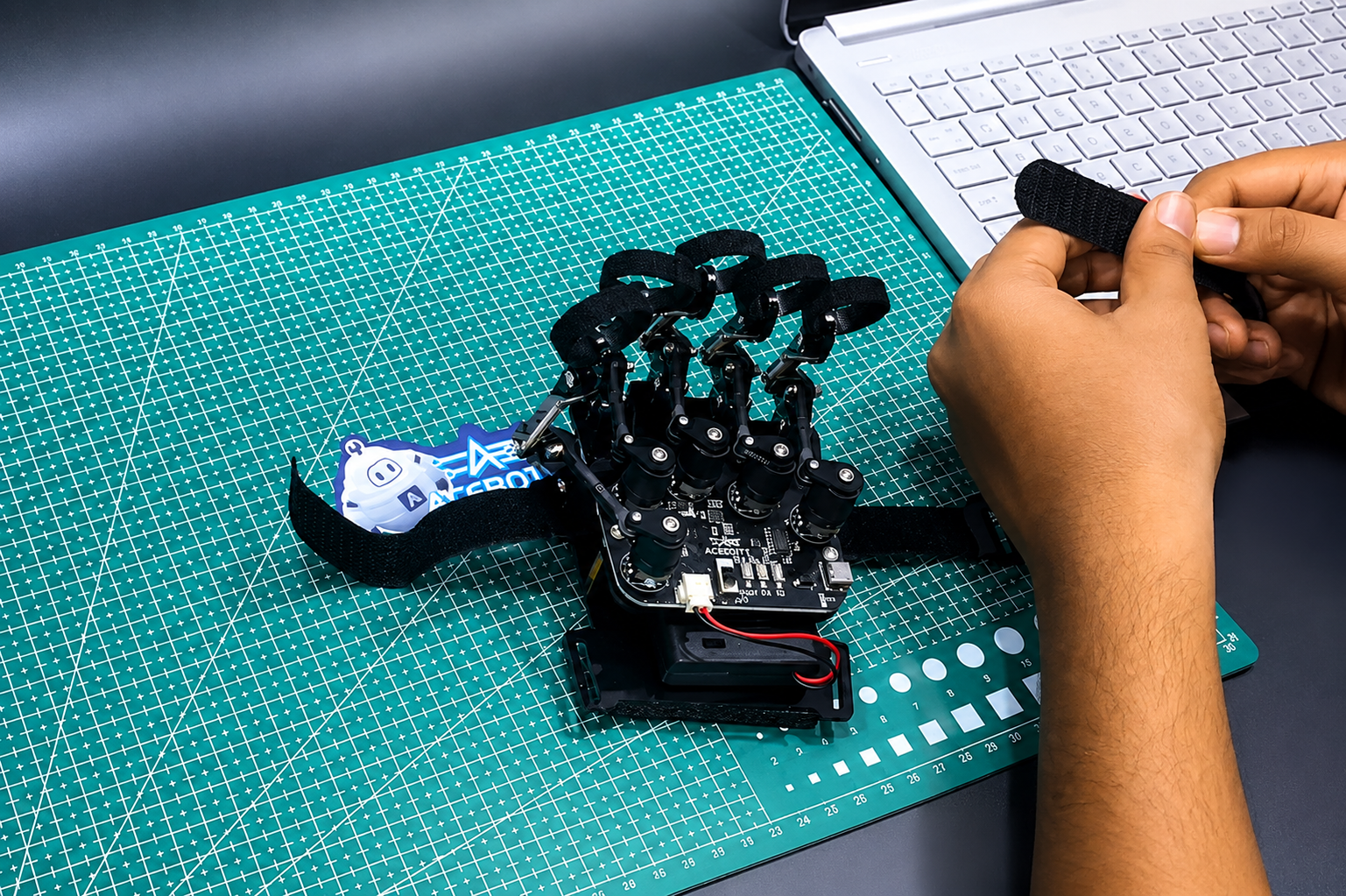Assembling the ACEBOTT QD023 Motion Sensing Glove on a cutting mat